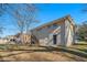 Rear view of house showcasing wooden stairs and backyard at 3860 Wisteria Sw Ln, Atlanta, GA 30331