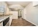 Eat-in kitchen with granite countertops and white cabinets at 3860 Wisteria Sw Ln, Atlanta, GA 30331