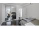 Bright bedroom featuring hardwood floors, closet with mirrored doors and comfortable decor at 620 Peachtree Ne St # 1206, Atlanta, GA 30308