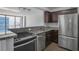 Updated kitchen with granite countertops, stainless steel appliances, and modern cabinetry at 620 Peachtree Ne St # 1206, Atlanta, GA 30308