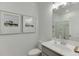 Bright bathroom featuring modern fixtures, white cabinets, and a glass-enclosed shower at 628 Gilles Ln, Cumming, GA 30041