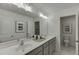 Well-lit bathroom with double sinks, ample counter space, and modern fixtures at 628 Gilles Ln, Cumming, GA 30041