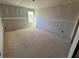 Bright bedroom showing new construction with drywall installed and a window overlooking the yard at 628 Gilles Ln, Cumming, GA 30041