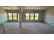 Unfinished living room featuring multiple windows offering lots of natural light at 628 Gilles Ln, Cumming, GA 30041