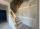 Unfinished staircase with wooden railings and drywall, ready for customization at 628 Gilles Ln, Cumming, GA 30041