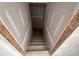 Unfinished staircase with concrete steps framed by wood, leading to potential below at 628 Gilles Ln, Cumming, GA 30041