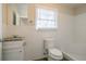 Clean bathroom with granite vanity and white tile at 2190 Greystone Way, Decatur, GA 30032