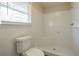 Updated bathroom with shower and white tile at 2190 Greystone Way, Decatur, GA 30032