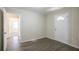 Bright bedroom with wood-look flooring and an exterior door at 2190 Greystone Way, Decatur, GA 30032