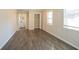 Spacious bedroom with dark gray wood-look flooring and lots of natural light at 2190 Greystone Way, Decatur, GA 30032