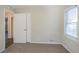 Bedroom with closet, window, and neutral decor at 2190 Greystone Way, Decatur, GA 30032