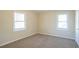 Bright bedroom featuring two windows and carpet at 2190 Greystone Way, Decatur, GA 30032