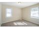 Sunny bedroom with two windows and carpeted floor at 2190 Greystone Way, Decatur, GA 30032