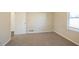 Well-lit bedroom with carpet and access to hallway at 2190 Greystone Way, Decatur, GA 30032