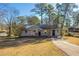 Brick ranch home with a spacious yard and driveway at 2190 Greystone Way, Decatur, GA 30032