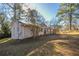 Side view of a ranch house showcasing its landscaping at 2190 Greystone Way, Decatur, GA 30032