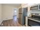 Stainless steel appliances and granite countertops in this updated kitchen at 2190 Greystone Way, Decatur, GA 30032