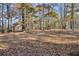 Spacious backyard with shed and mature trees at 128 Wayne Meadows Ct, Douglasville, GA 30134