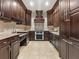 Dark wood kitchen with stainless steel appliances at 2255 Peachtree Ne Rd # 724, Atlanta, GA 30309