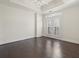 Large bedroom with hardwood floors and access to balcony at 2255 Peachtree Ne Rd # 724, Atlanta, GA 30309