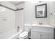 Clean bathroom with white subway tile and a vanity with marble top at 4057 Crossings Way, Stone Mountain, GA 30083