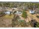 Aerial view of home, pool, and surrounding landscape at 4386 Bluebird Ln, Lithia Springs, GA 30122