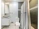 Bathroom with grey tile shower, toilet, and floating vanity at 4386 Bluebird Ln, Lithia Springs, GA 30122