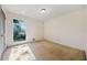 Spacious bedroom with large window and neutral carpeting at 4386 Bluebird Ln, Lithia Springs, GA 30122