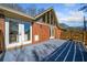 Spacious deck with brick home and wood railings at 4386 Bluebird Ln, Lithia Springs, GA 30122