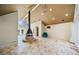 Sunlit living room with vaulted ceiling, fireplace, and tiled floors at 4386 Bluebird Ln, Lithia Springs, GA 30122