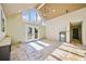 Living area with vaulted ceiling, tiled floors, and access to patio at 4386 Bluebird Ln, Lithia Springs, GA 30122