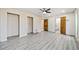 Living room featuring wood-look flooring and two doors at 4386 Bluebird Ln, Lithia Springs, GA 30122