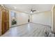 Living Room with grey vinyl plank flooring and ceiling fan at 4386 Bluebird Ln, Lithia Springs, GA 30122