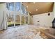Spacious living room with large windows, fireplace, and tiled floors at 4386 Bluebird Ln, Lithia Springs, GA 30122