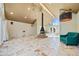Living room with vaulted ceiling, fireplace, and tiled floors at 4386 Bluebird Ln, Lithia Springs, GA 30122
