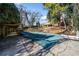 In-ground pool with pool cover and backyard access at 4386 Bluebird Ln, Lithia Springs, GA 30122