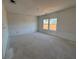 Unfurnished bedroom with two windows and unfinished walls at 2125 Boxwood Circle Se, Conyers, GA 30094