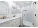 Elegant bathroom with marble tile, double vanity, and walk-in shower at 1863 Bruce Ne Rd, Atlanta, GA 30329