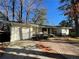 Recently updated white brick ranch house with a modern garage and brick walkway at 1863 Bruce Ne Rd, Atlanta, GA 30329