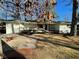 White brick ranch house with wood details, a large yard, and a paved driveway at 1863 Bruce Ne Rd, Atlanta, GA 30329