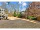 Large backyard with grassy area and wooden fence at 1926 Fairway Ne Cir, Brookhaven, GA 30319