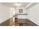 Finished basement features a wet bar with granite countertops and white cabinetry at 1926 Fairway Ne Cir, Brookhaven, GA 30319