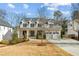 Two story farmhouse style home with front yard at 1926 Fairway Ne Cir, Brookhaven, GA 30319