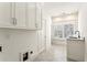 Bright laundry room with built-in cabinets and sink at 1926 Fairway Ne Cir, Brookhaven, GA 30319