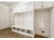 White built-in bench with storage and hooks at 1926 Fairway Ne Cir, Brookhaven, GA 30319