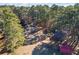 Aerial view of property showing home, shed, and wooded area at 2529 Piney Grove Rd, Loganville, GA 30052