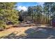 Aerial view of property showing home, shed, and wooded area at 2529 Piney Grove Rd, Loganville, GA 30052