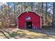 Red barn with American flag and golf cart inside at 2529 Piney Grove Rd, Loganville, GA 30052