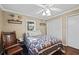 Bedroom with a queen bed, hardwood floors, and ceiling fan at 2529 Piney Grove Rd, Loganville, GA 30052