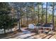 Gravel driveway leading to the property with storage sheds visible at 2529 Piney Grove Rd, Loganville, GA 30052